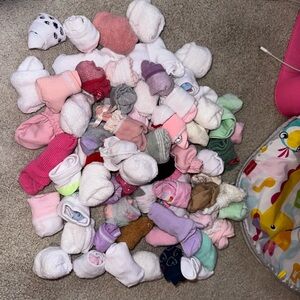 Lots of baby socks and mittens